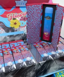 Whole Melt Hawaiian Dew vape with tropical fruits, citrus splash, and island-inspired design