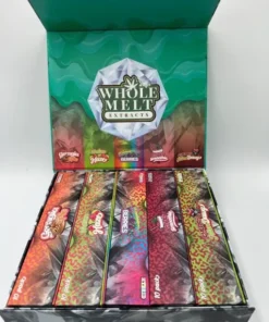 Whole Melt Melon Haze vape with juicy melon slices and soft hazy vapor effect