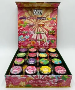 Whole Melt Candy Edition premium live resin sugar with golden crystalline texture, sweet terpene profile, and lab-tested cannabis concentrate in sealed jar