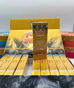 Whole Melt Yellow Melonz vape with vibrant yellow melon flavor and premium packaging
